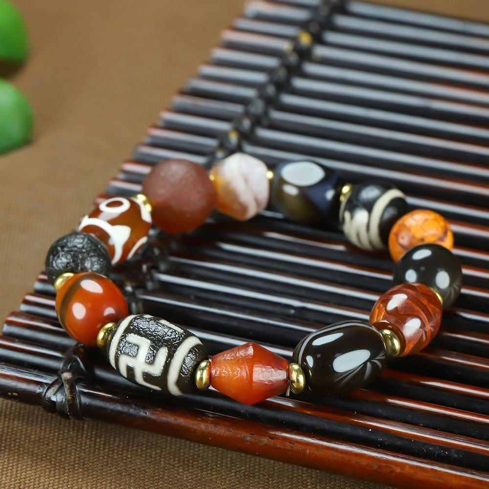 Tibetan Three Eye Tiger Tooth Dzi Bead Bracelet