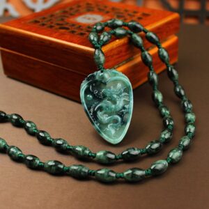 Man wearing natural Grade A jadeite dragon pendant necklace with 43-bead chain