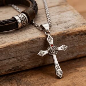 Man wearing vintage stainless steel crown cross pendant necklace with white shirt