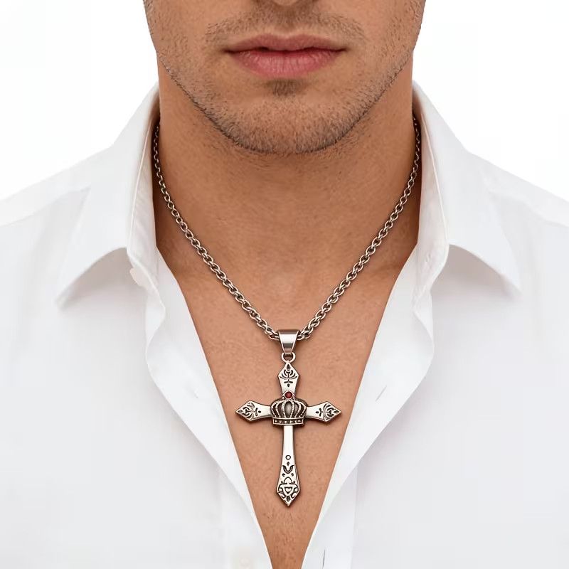 Man wearing vintage stainless steel crown cross pendant necklace with white shirt
