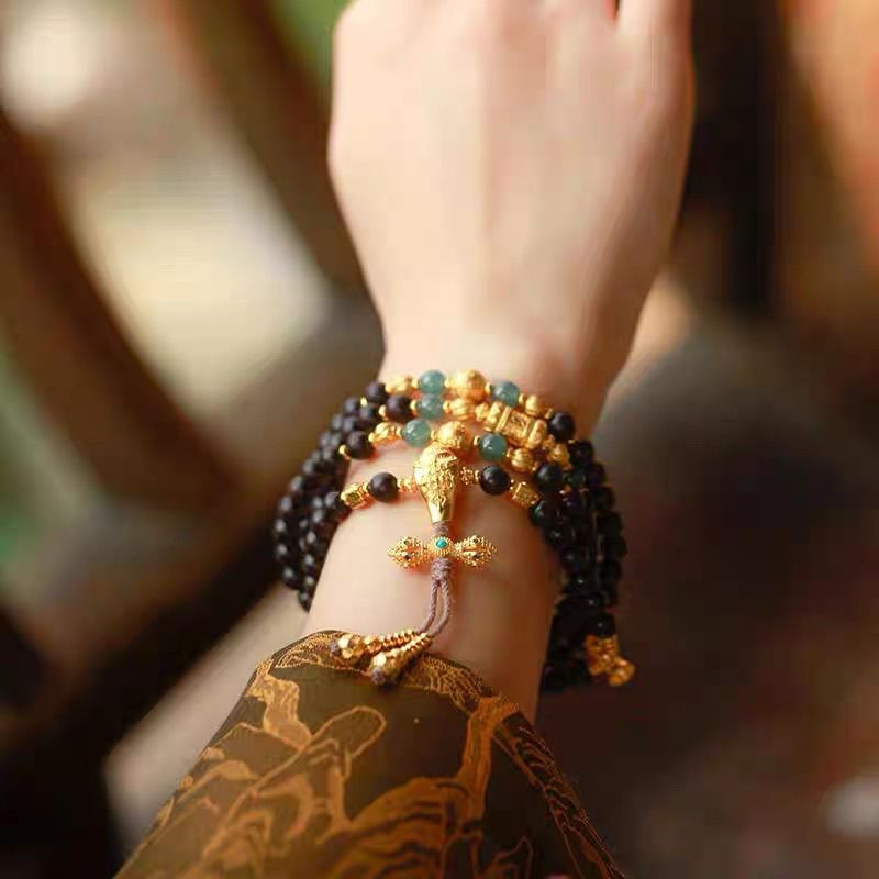 Multi wrap natural agarwood mala bracelet stack with ancient sand gold beads and vajra charm