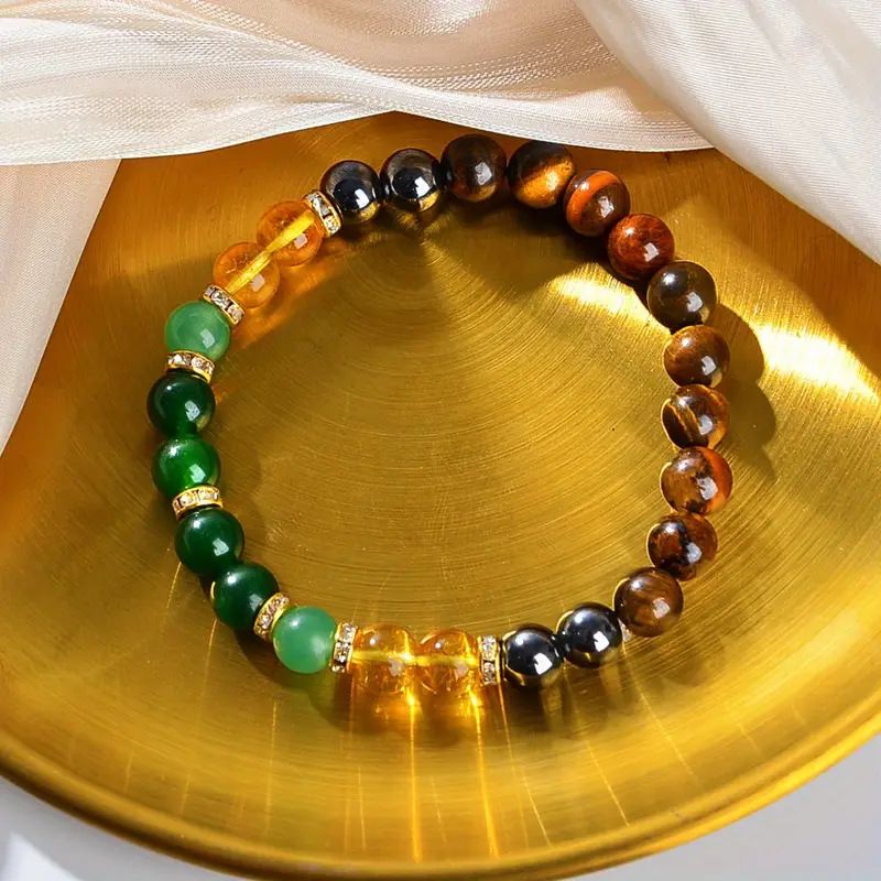 Unisex Wealth Manifestation Bracelet with gold rhinestone spacers and natural gemstones on golden tray