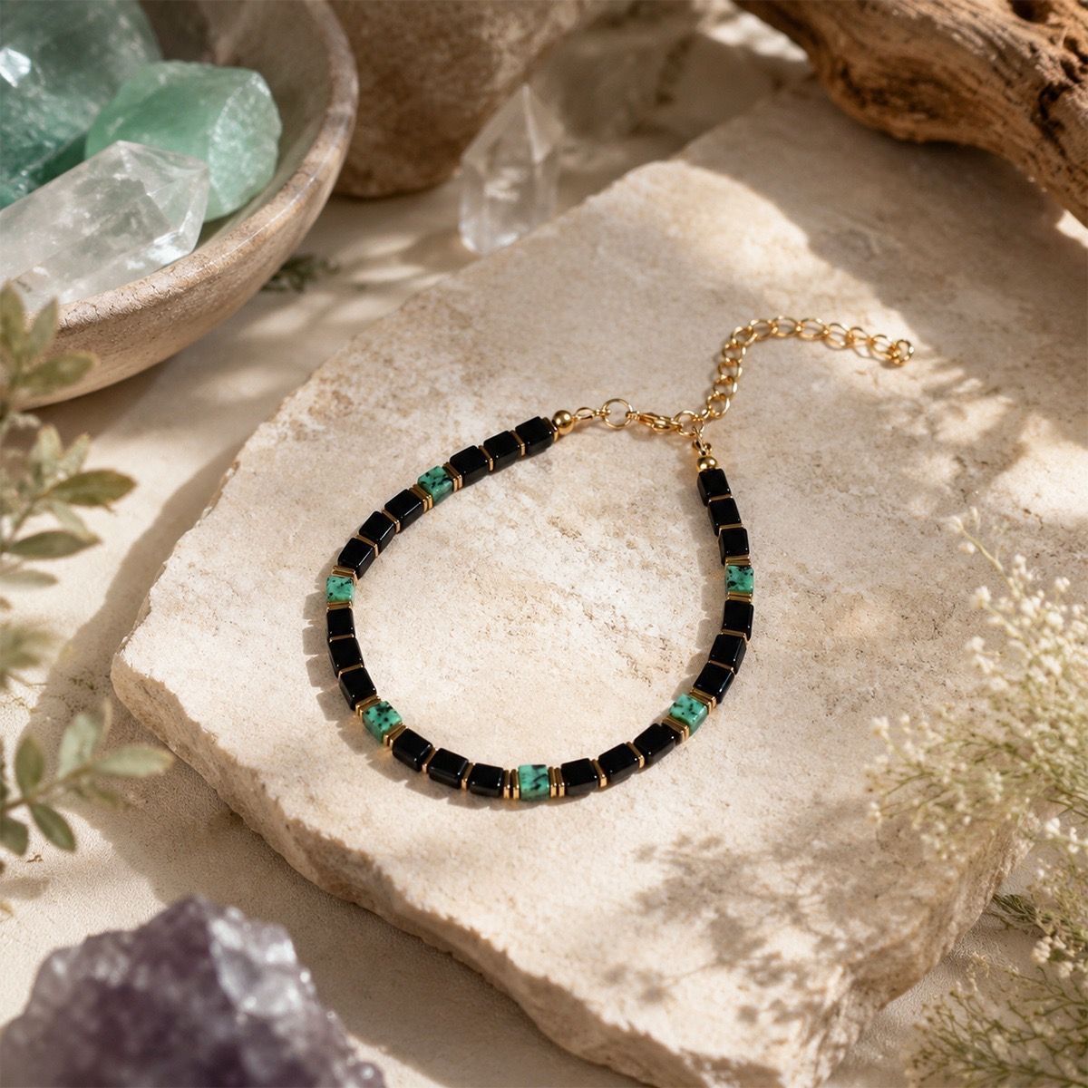 Obsidian Turquoise Bracelet displayed on natural beige stone background