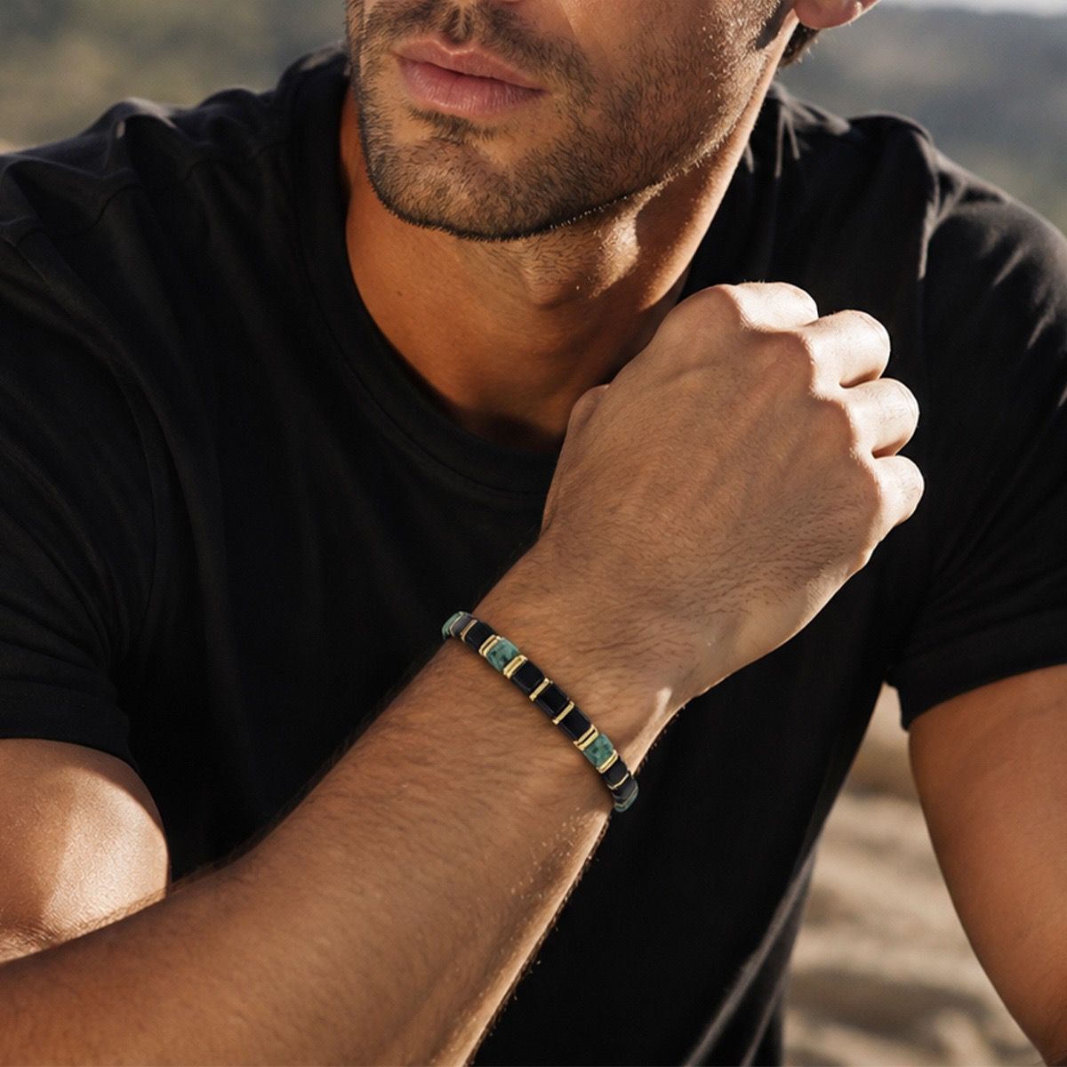 Close up of man wearing 4mm Obsidian Turquoise Bracelet on wrist